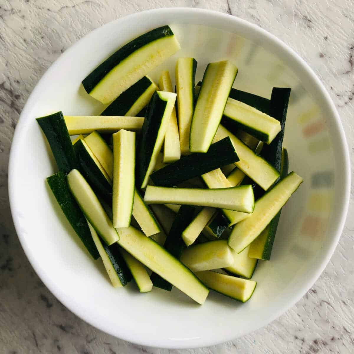 cut zucchini in fries shape.