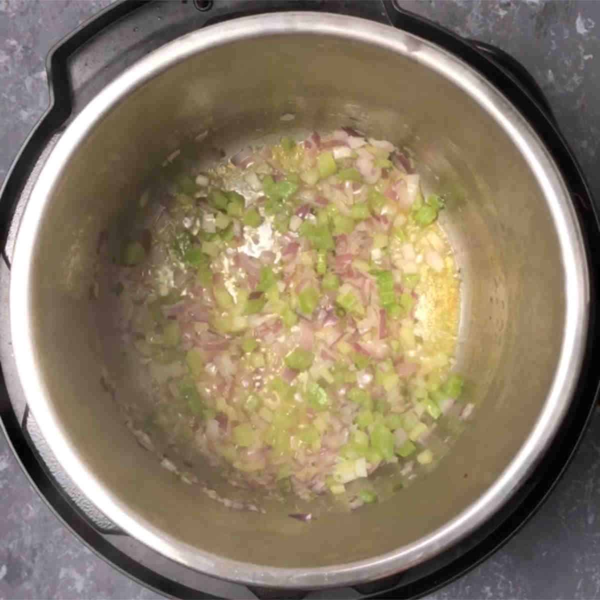 Step showing the initial saute of aromatics in Instant Pot.