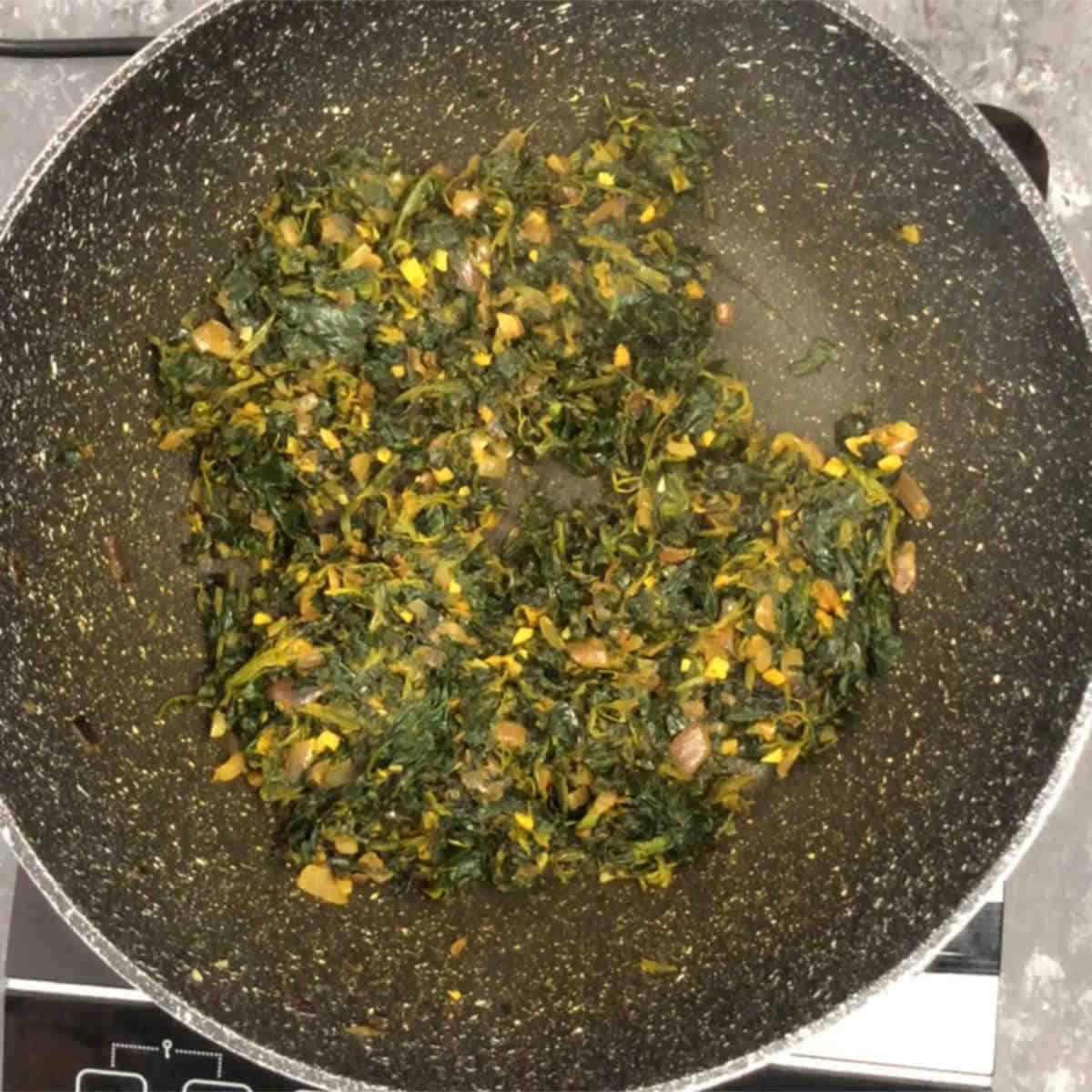 Cook the spinach and spices well.