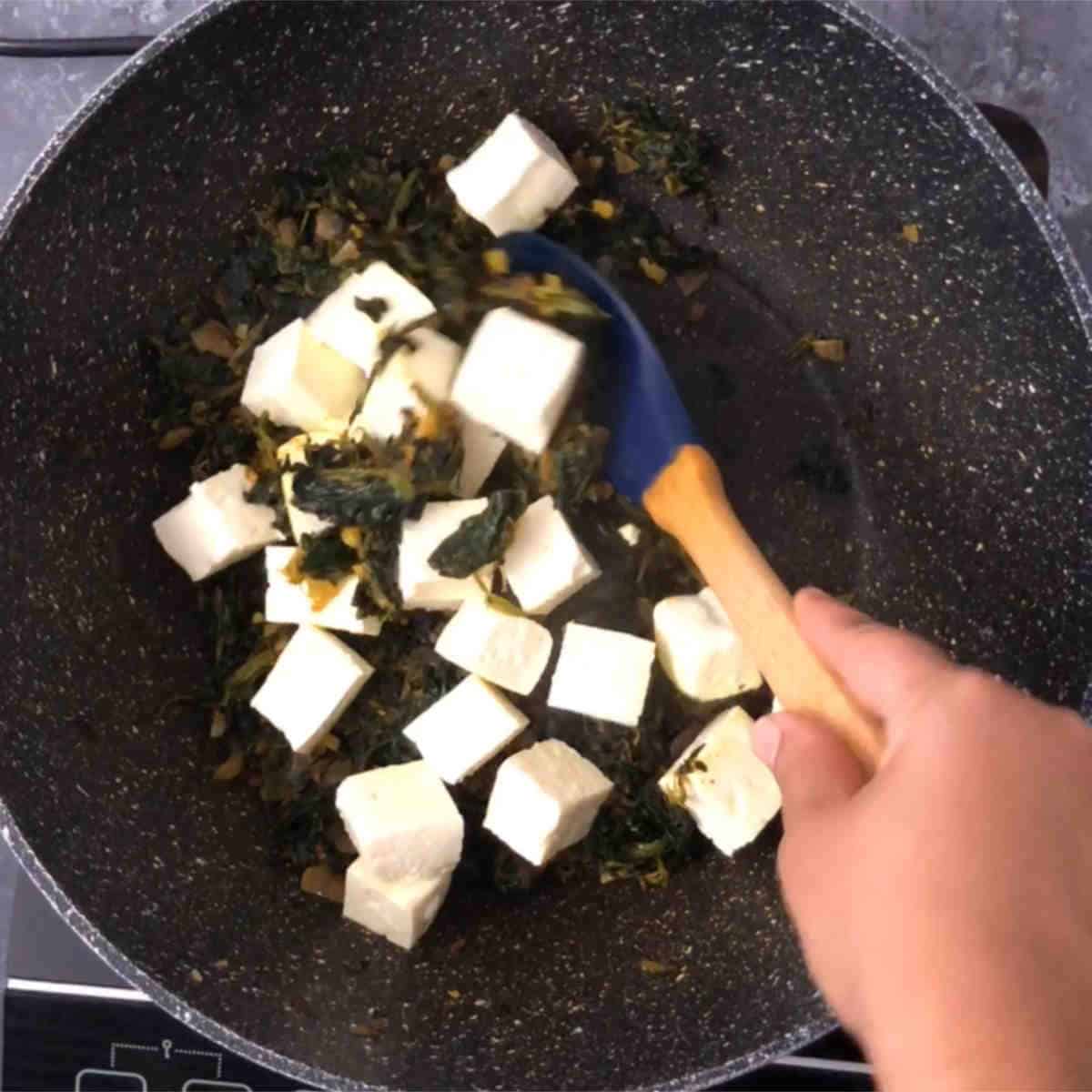 Add paneer cubes and mix gently.