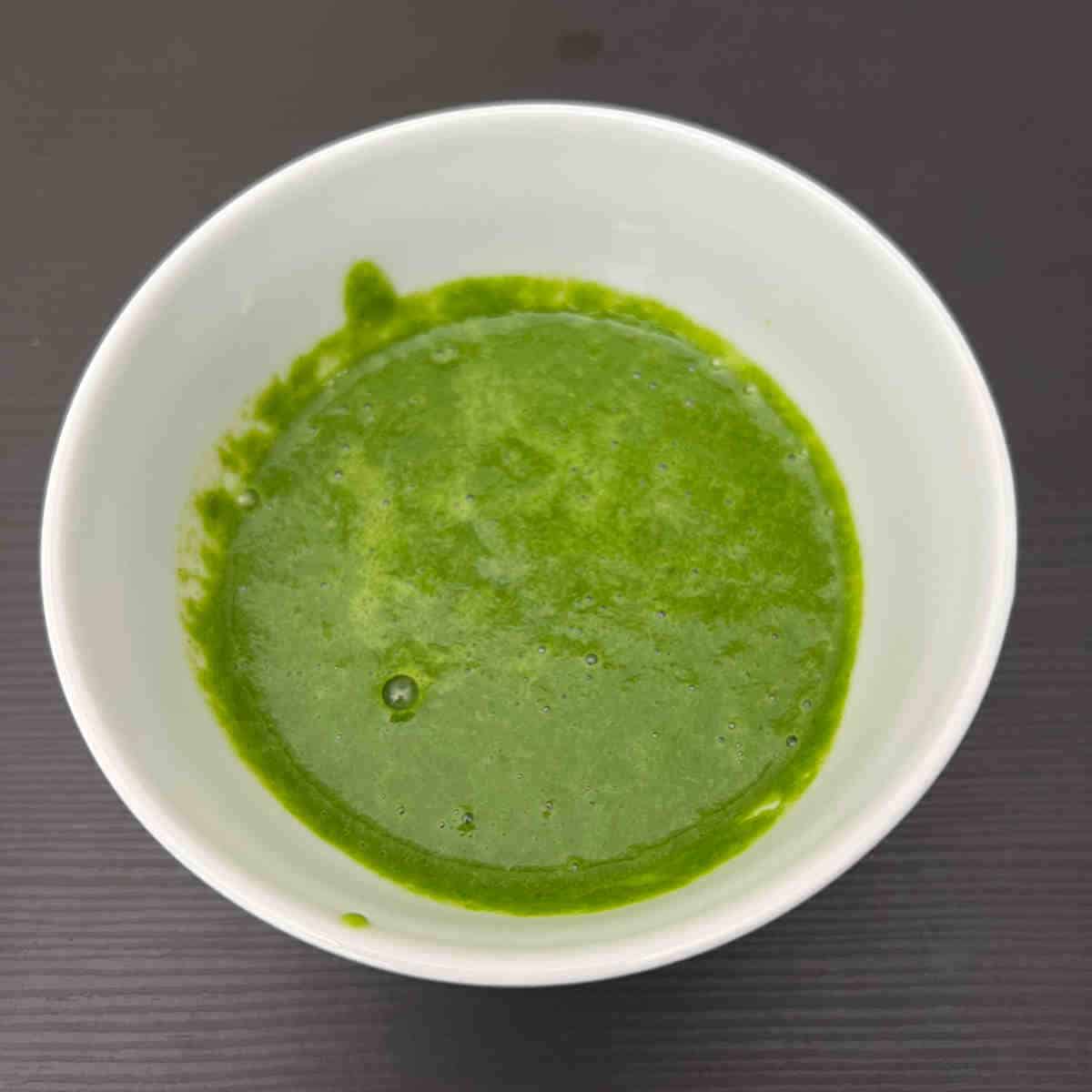 Grind green chutney ingredients into smooth paste.