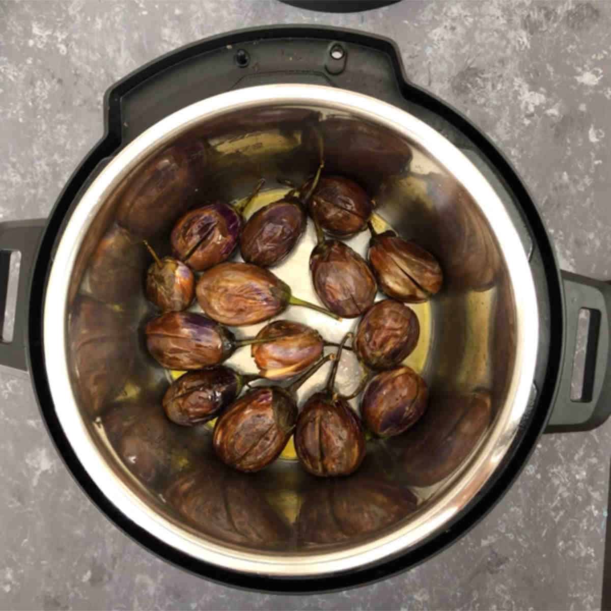 Fry eggplants in the Instant Pot and set them aside.