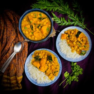 plates of pumpkin curry with rice.