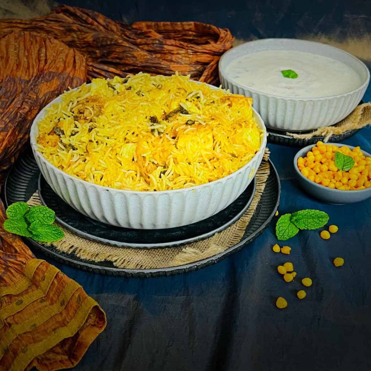 Instant pot paneer biryani placed in a white bowl.