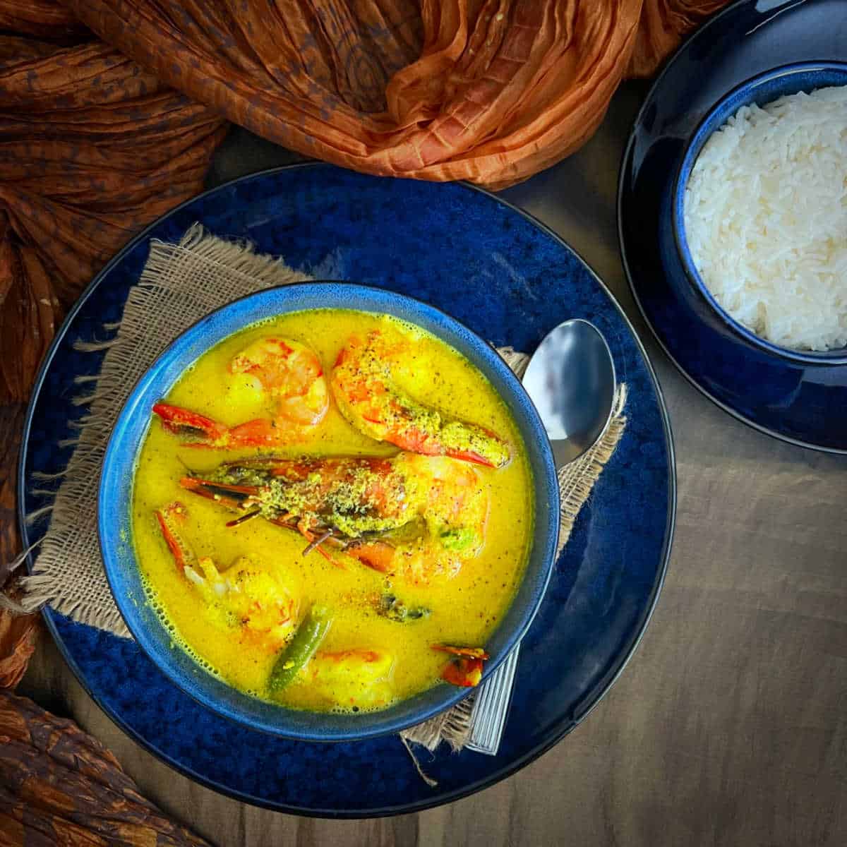 bhapa chingri or shrimp curry served with basmati rice.