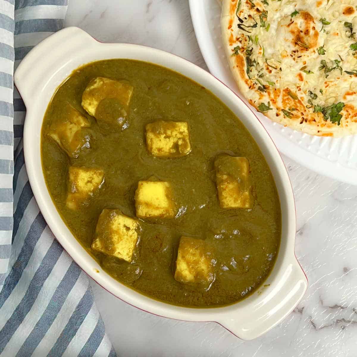 palak paneer served with naan.