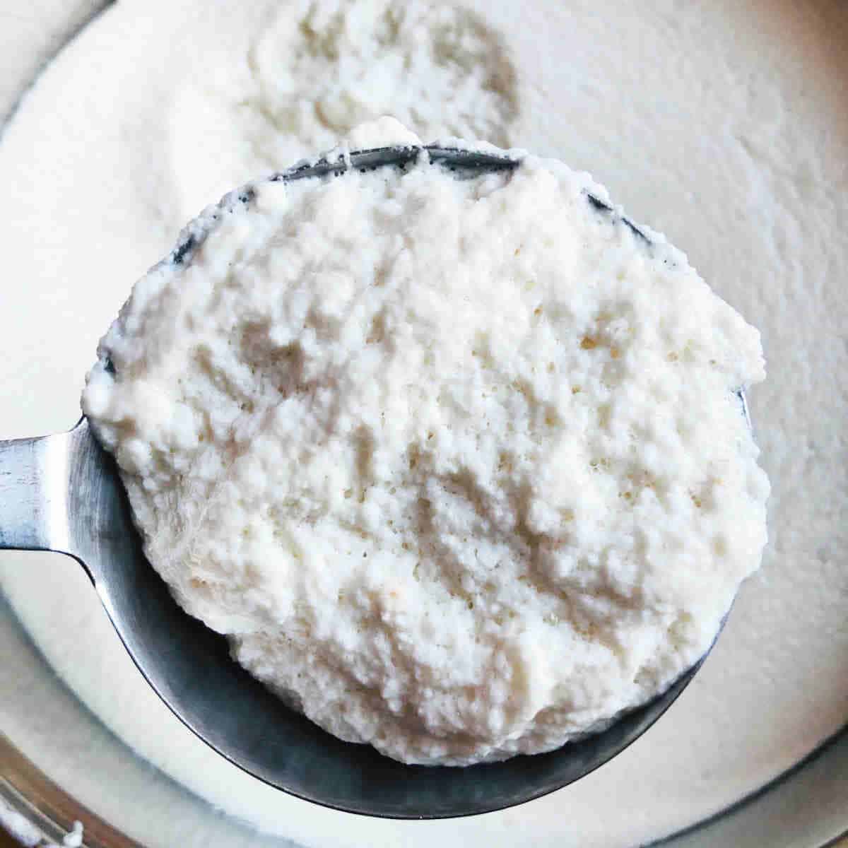Dosa batter in a ladle.