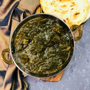 Lamb palak served with homemade naan bread.