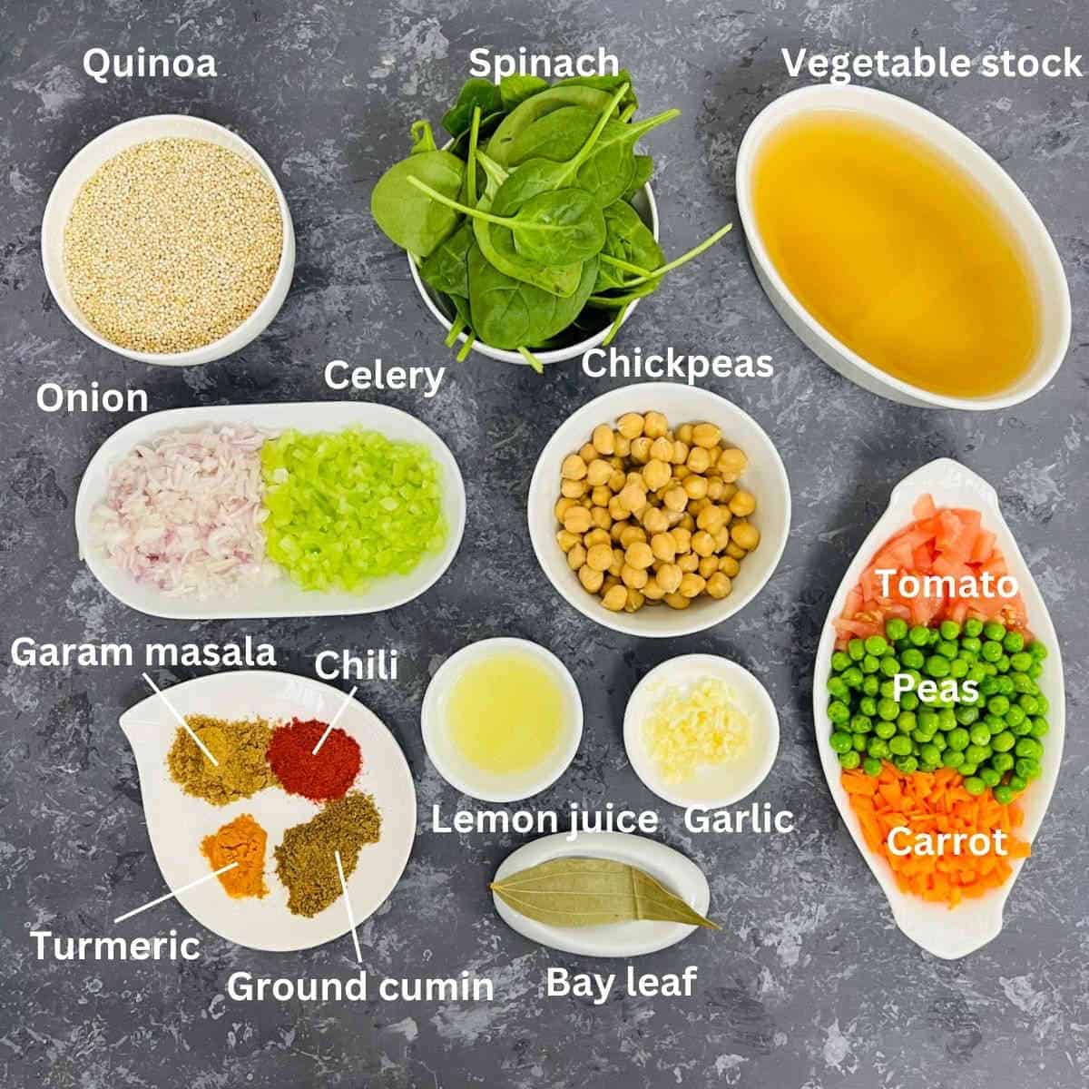 Quinoa soup ingredients placed on a grey surface.
