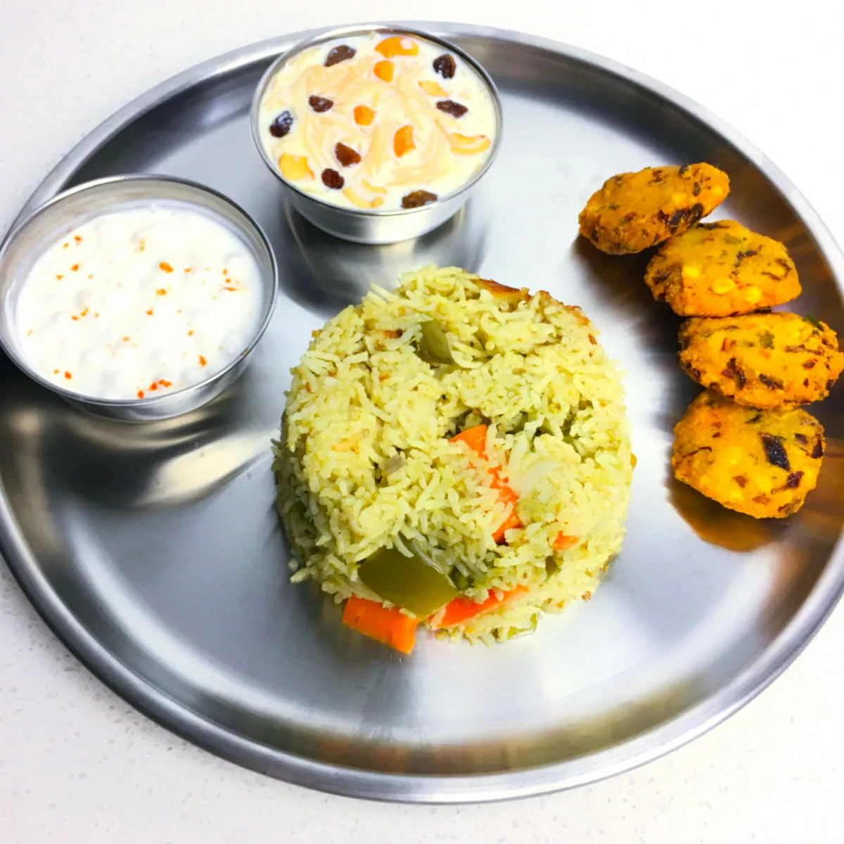 Pulao with vada and kheer.