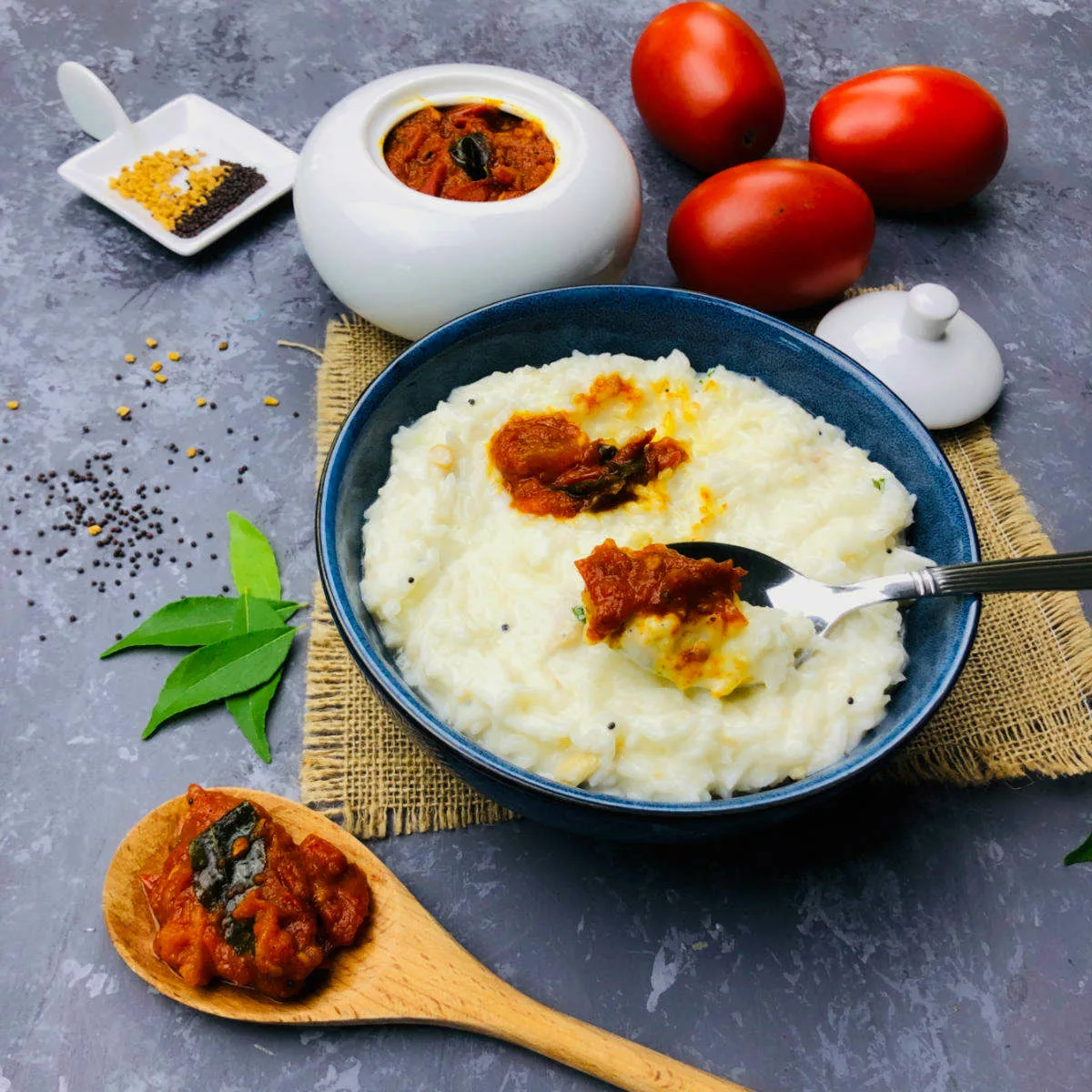 Tomato pickle served with curd rice.