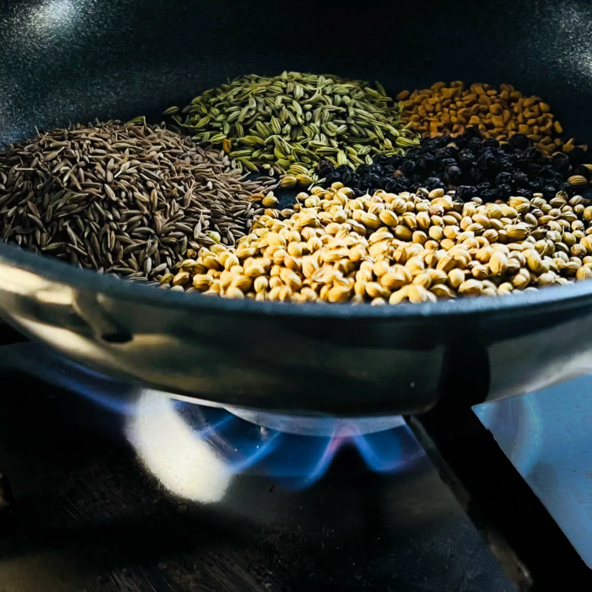 Roasting whole spices.