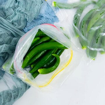 Frozen whole green chili peppers.
