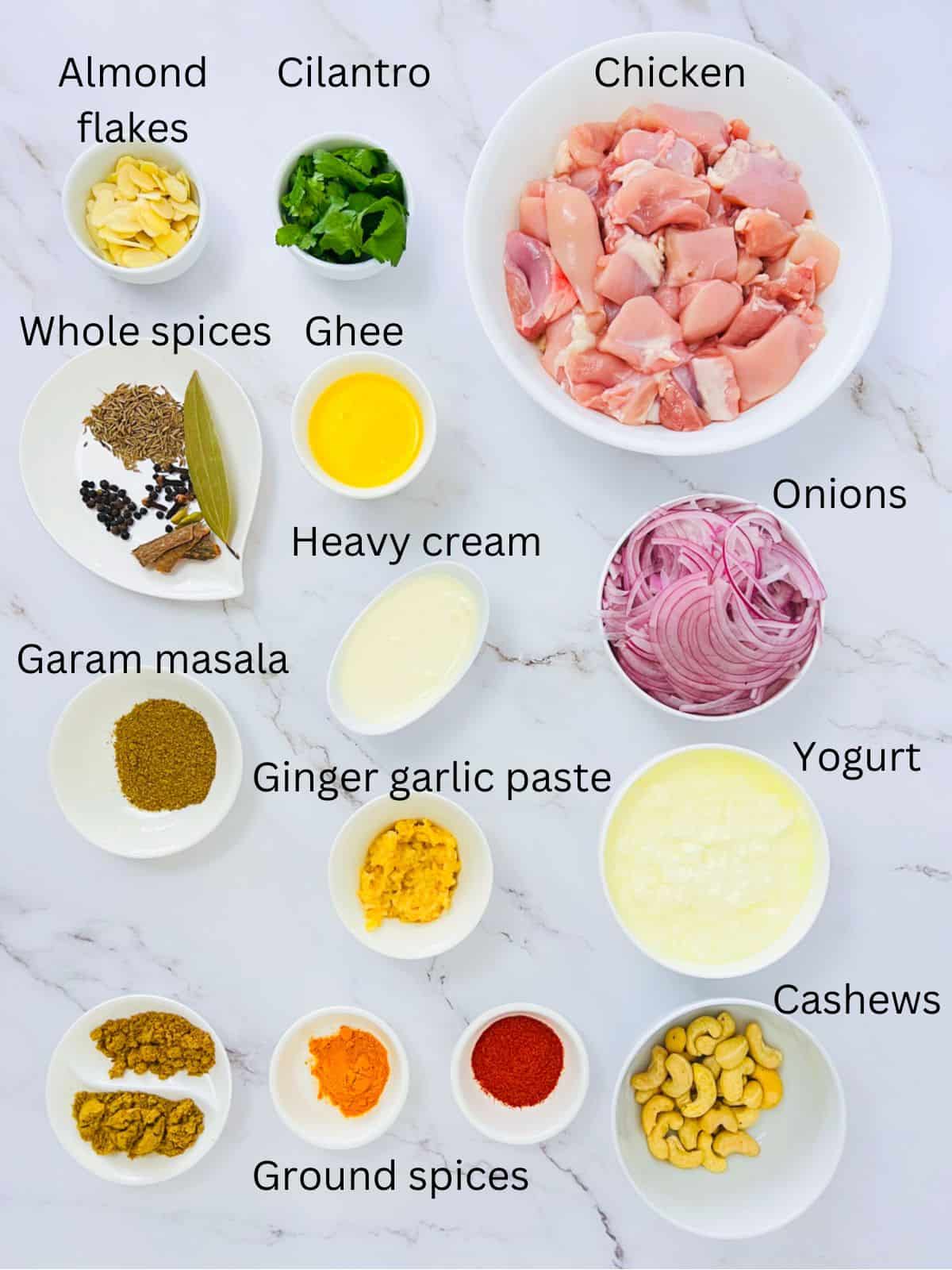 Ingredients to make chicken korma.