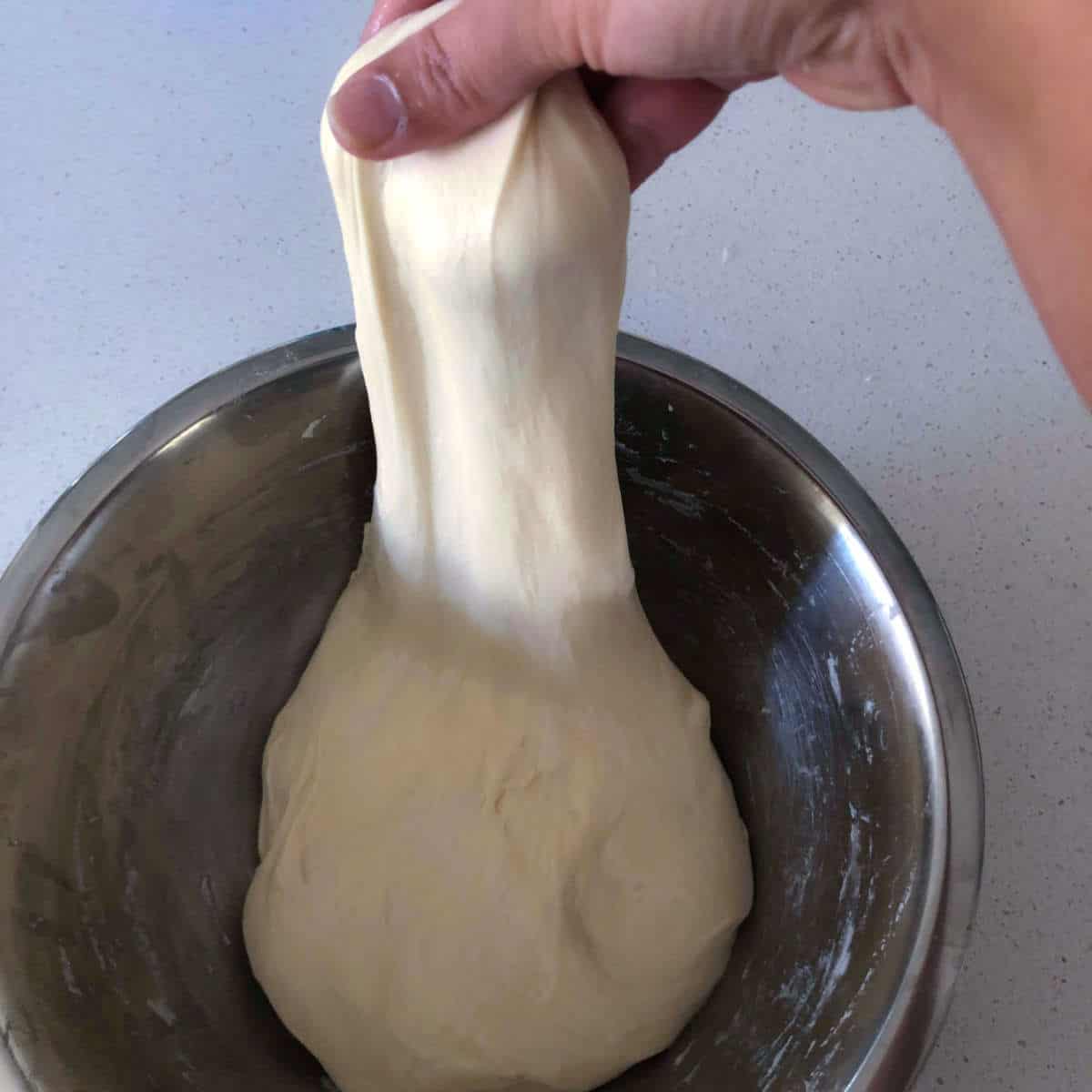 Pull the dough without breaking it.
