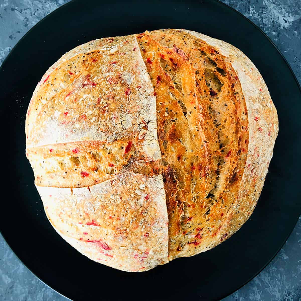 Beetroot sourdough boule to show the oven spring.