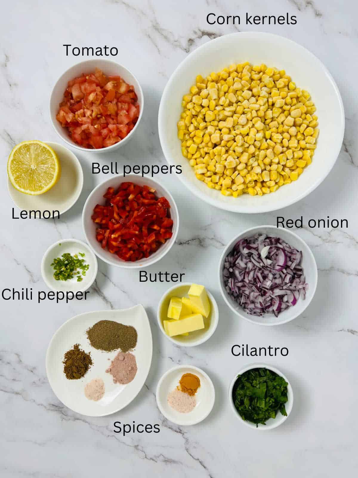 Corn chaat ingredients with labels.