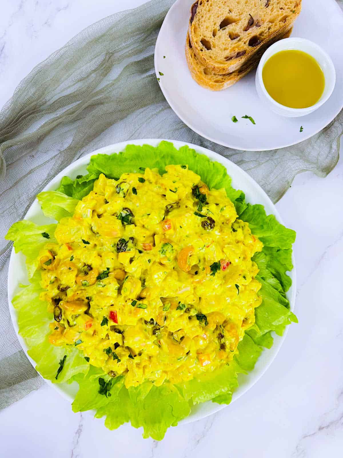 Curried chicken salad served on a bed of greens.