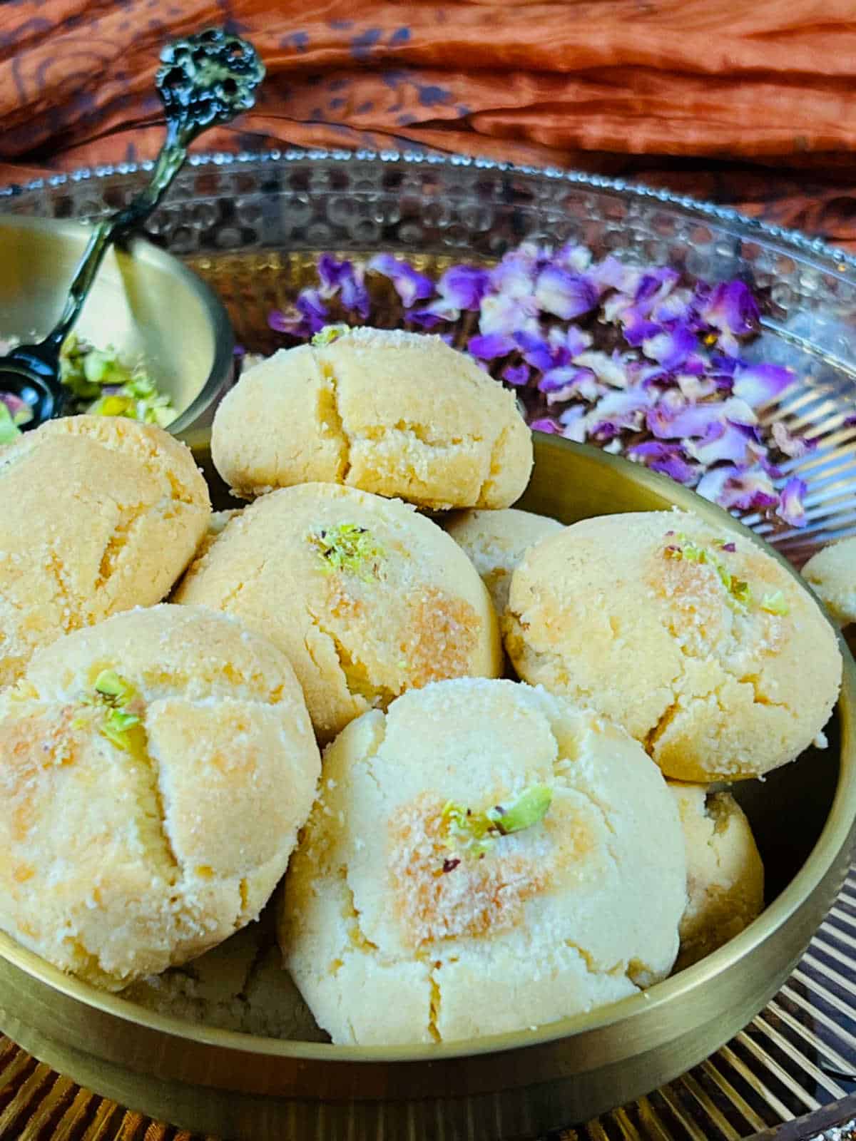 Close up view of naankhatai and pistachios.