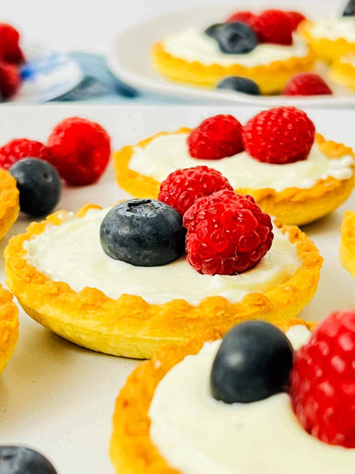 Mini shrikhand tarts with berries.