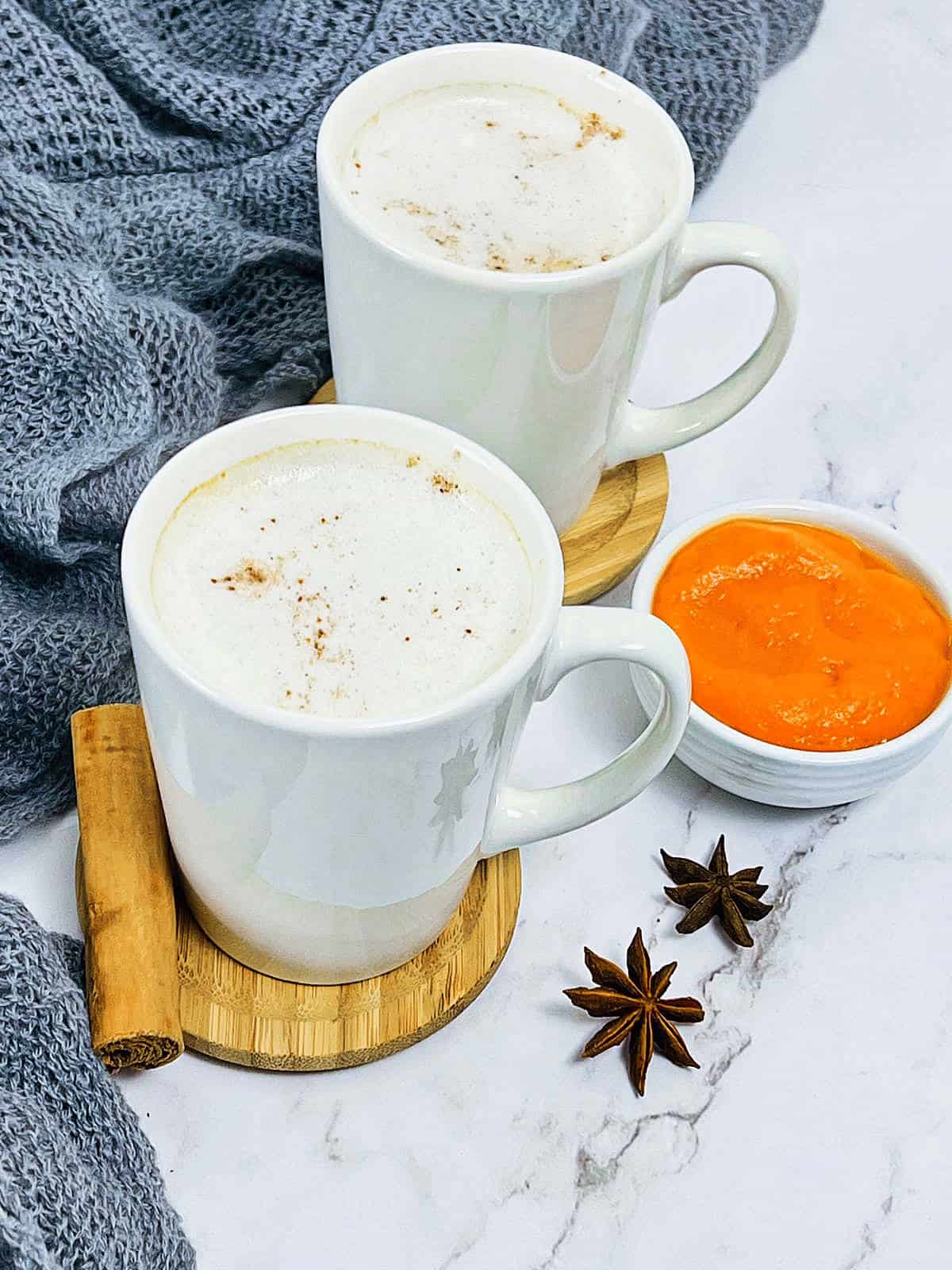 Chai pumpkin latte in white cups.