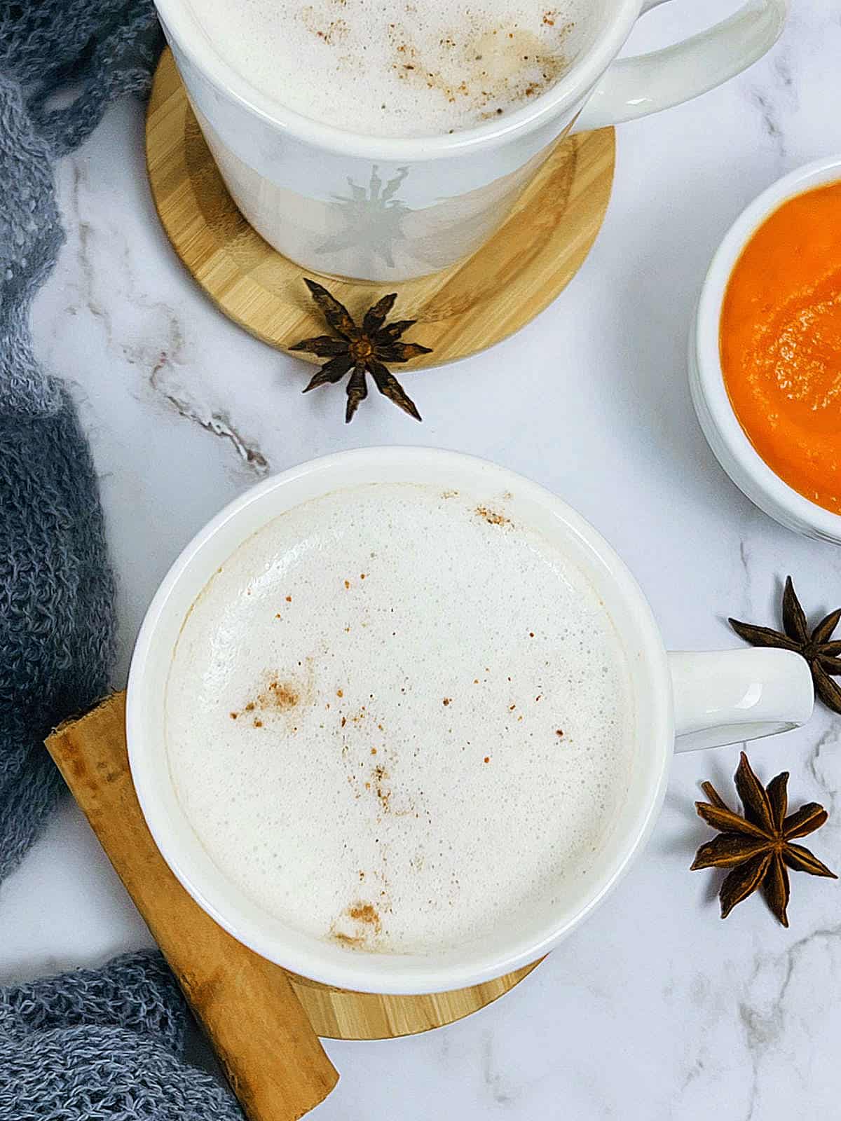 Pumpkin chai latte in white mugs.