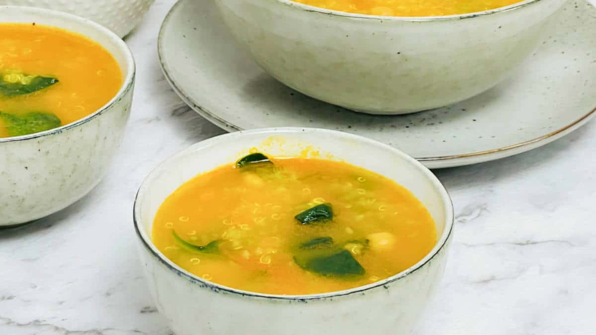 Quinoa chickpea soup in a bowl.