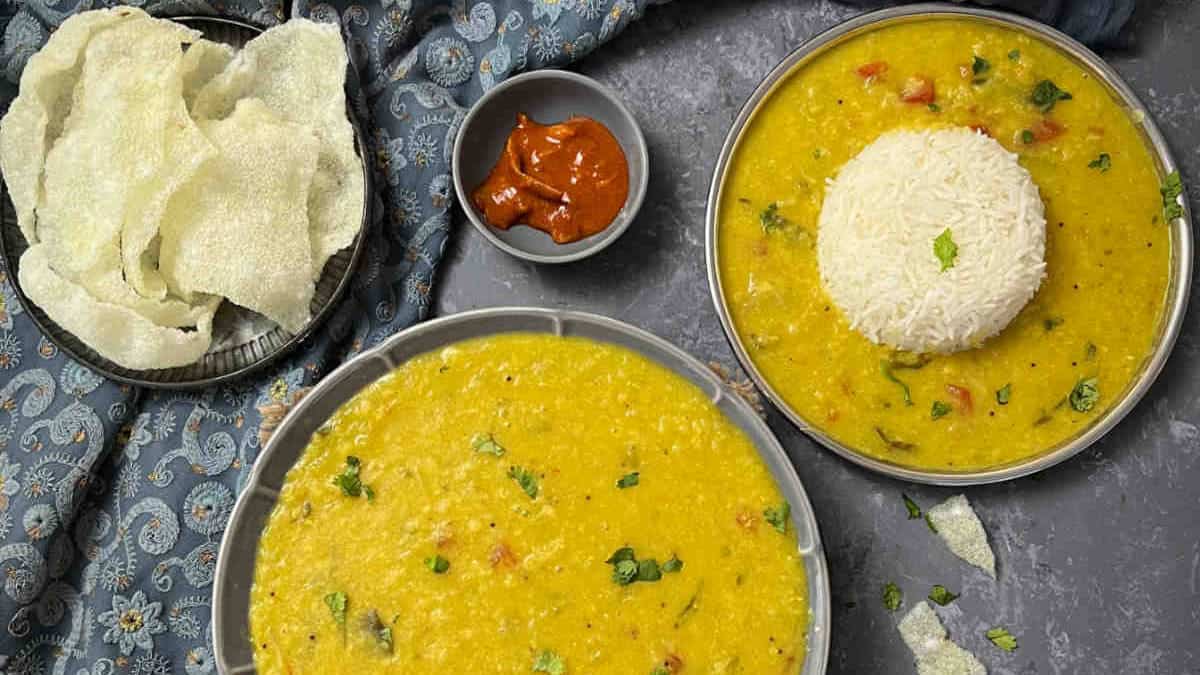 Cabbage dal served with rice and papad.