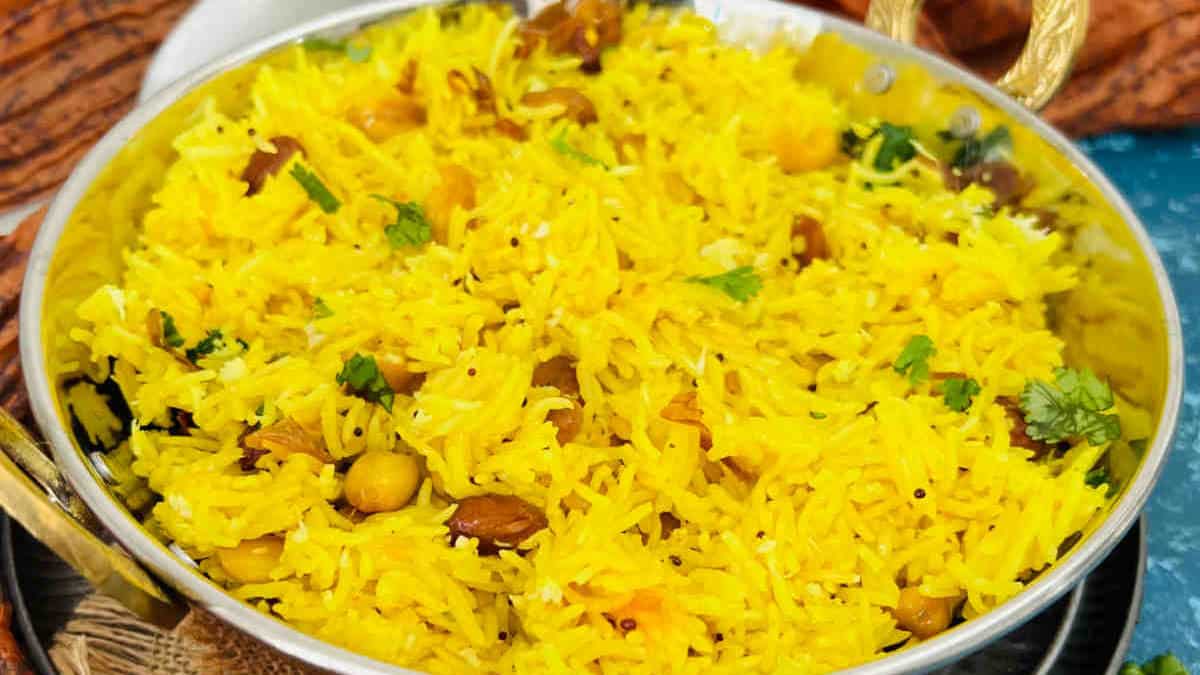 South Indian lemon rice served in a traditional kadhai.