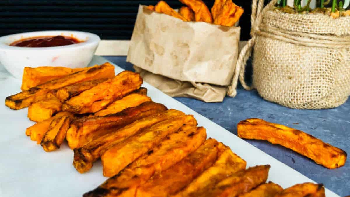 Sweet potato fries on a marble surface.