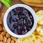 Blueberry chutney in a white bowl.