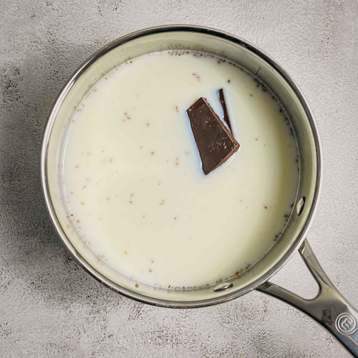 Chocolate and sugar in warm milk.