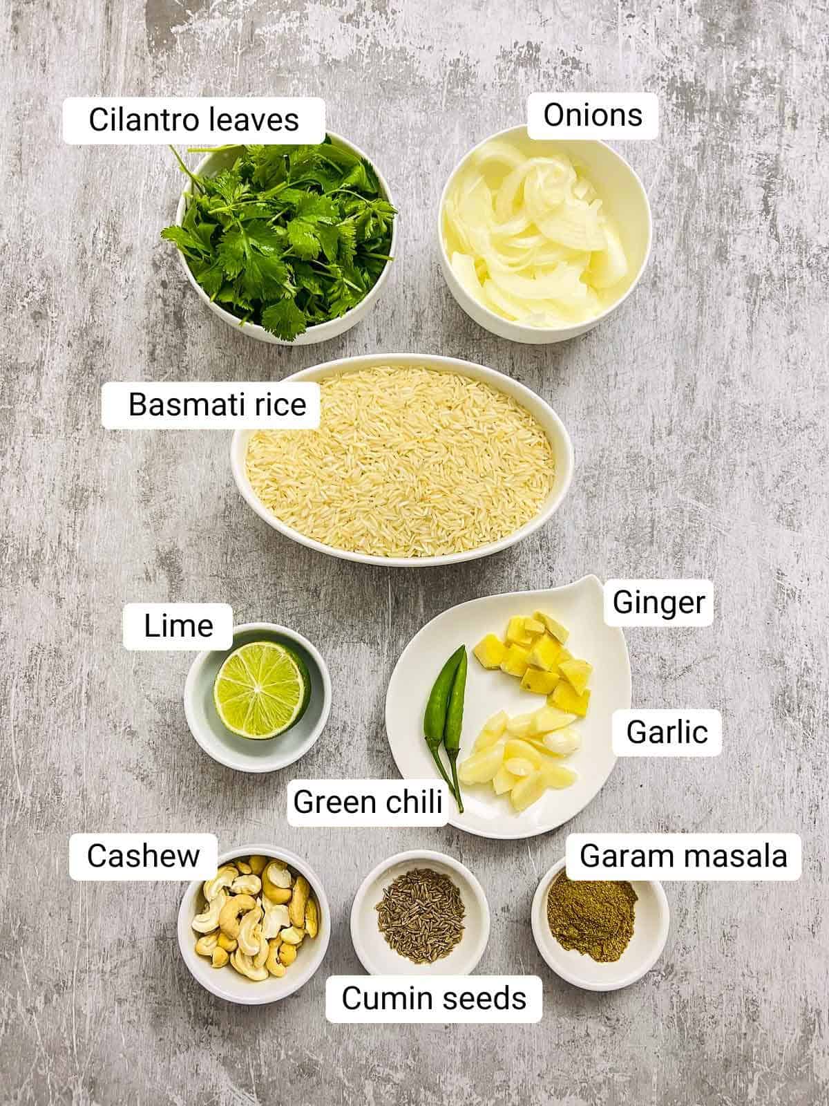 Ingredients to make cilantro rice placed on a grey surface.