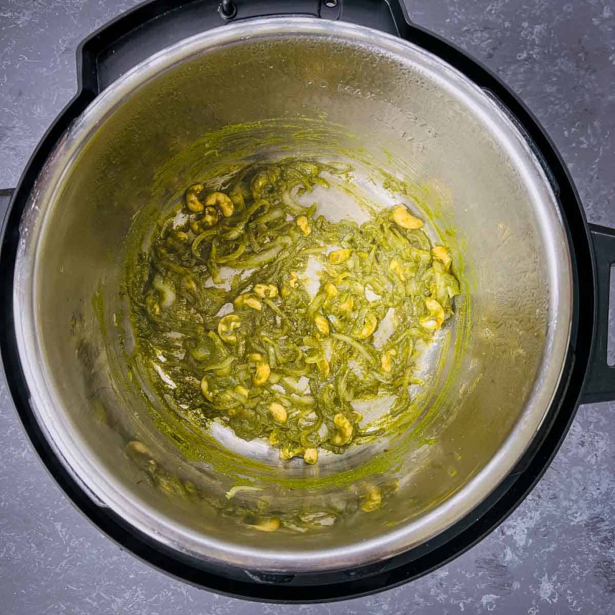 Cooked masala paste in Instant Pot inner pot.