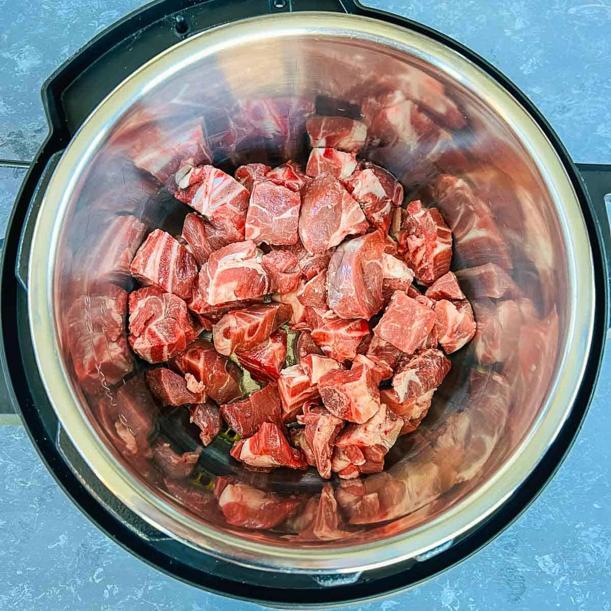 Sauted whole spices and lamb in the Instant Pot.