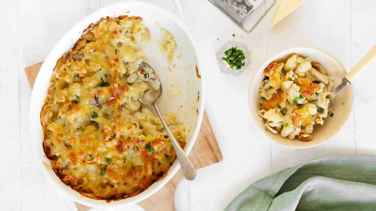 Blue cheese mac and cheese in a casserole and small white bowl.