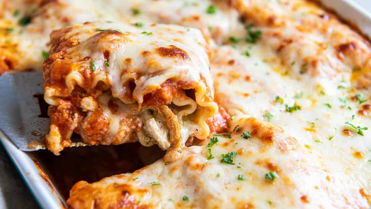 A slice of chicken lasagna roll-up.