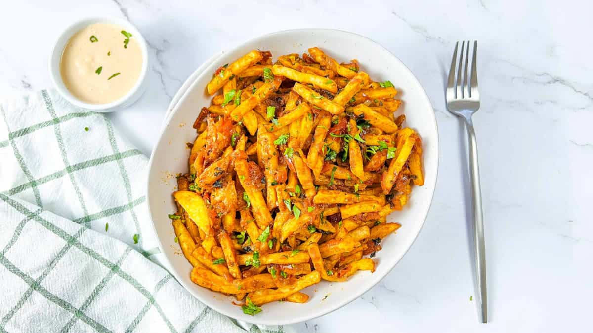 Masala fries in a white bowl.