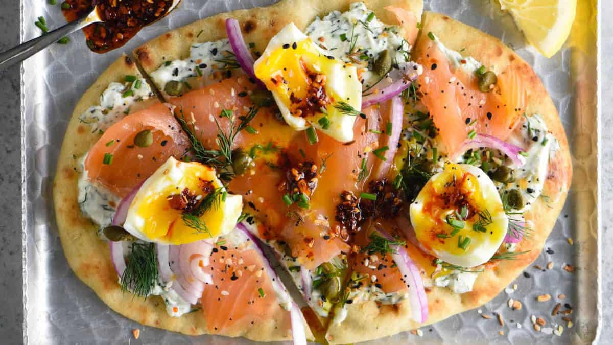 Salmon egg pizza on a tray.