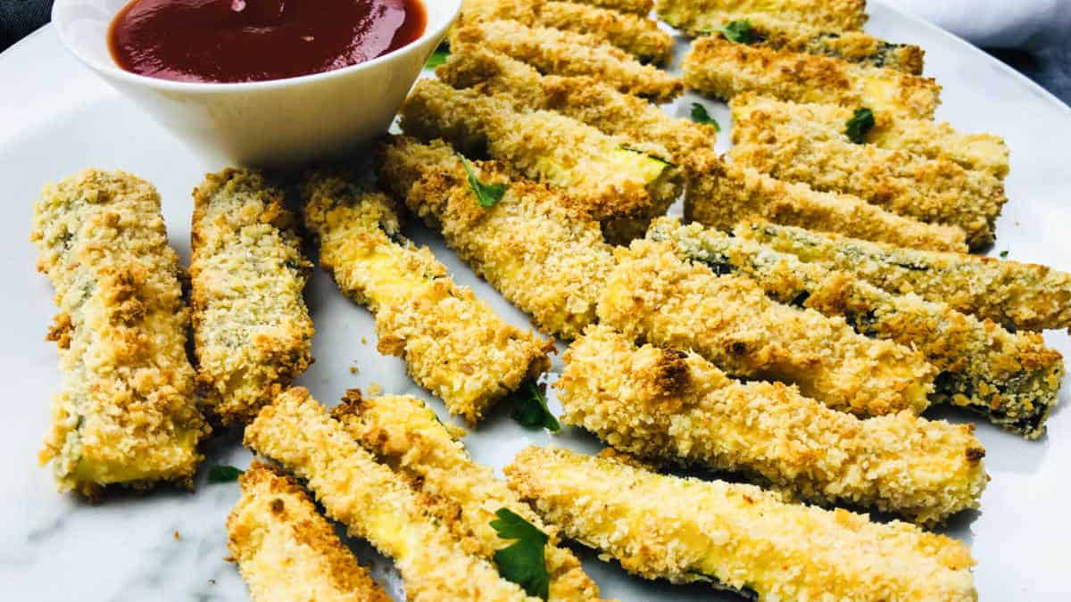 Zucchini fries on a white plate.