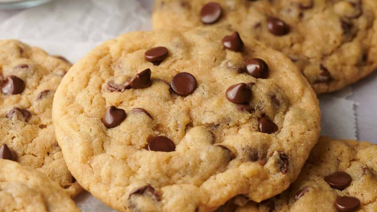 Chocolate chip cookies with a bite taken out of them.