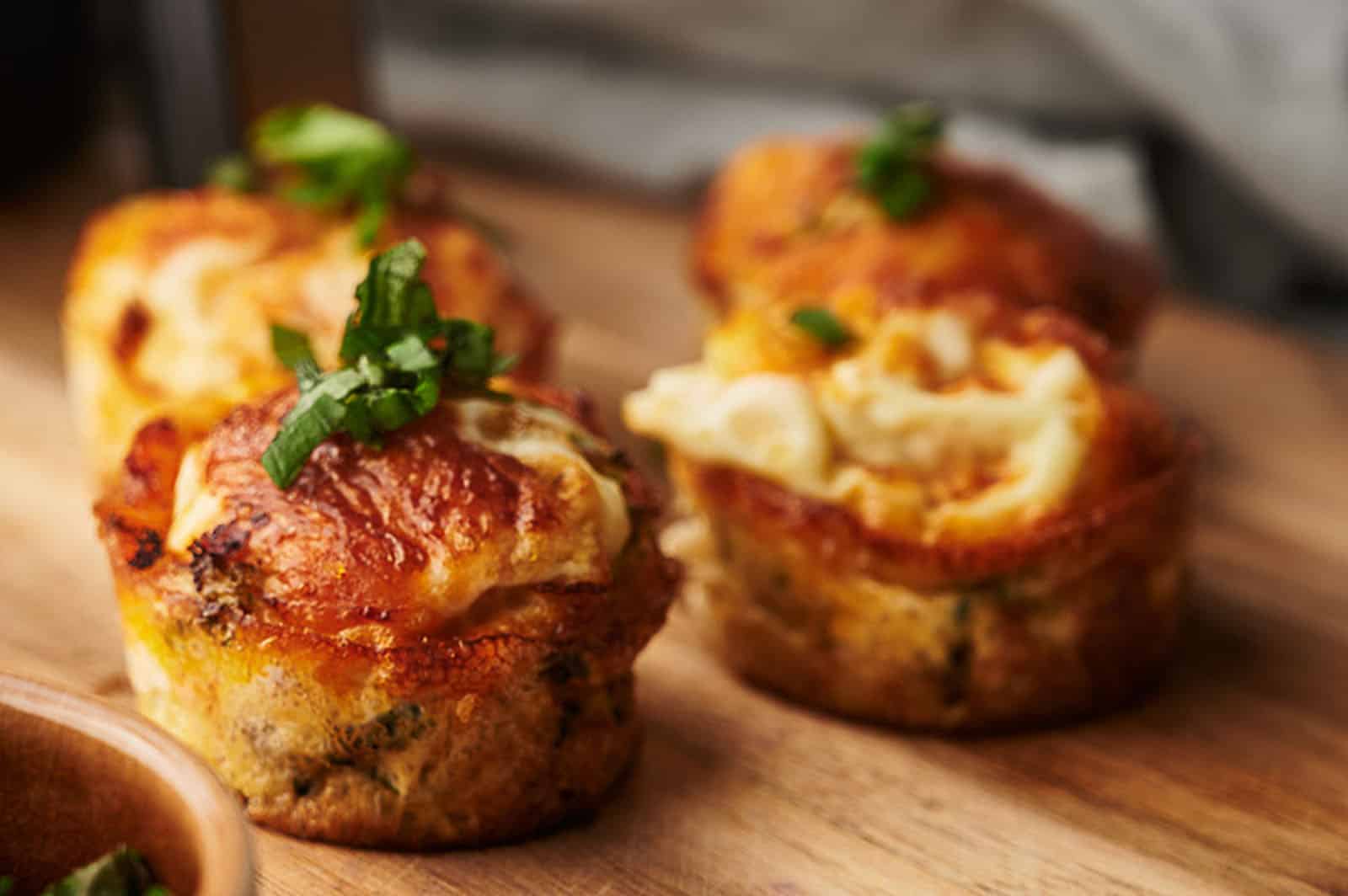 Egg Bites on a board with a little parsley on top.