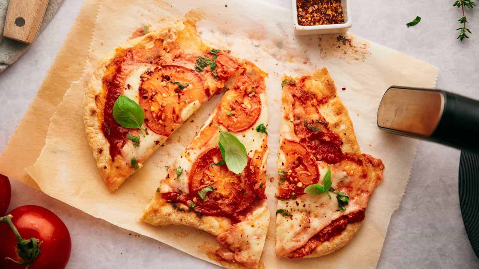 Two flatbread pizzas on a tray.