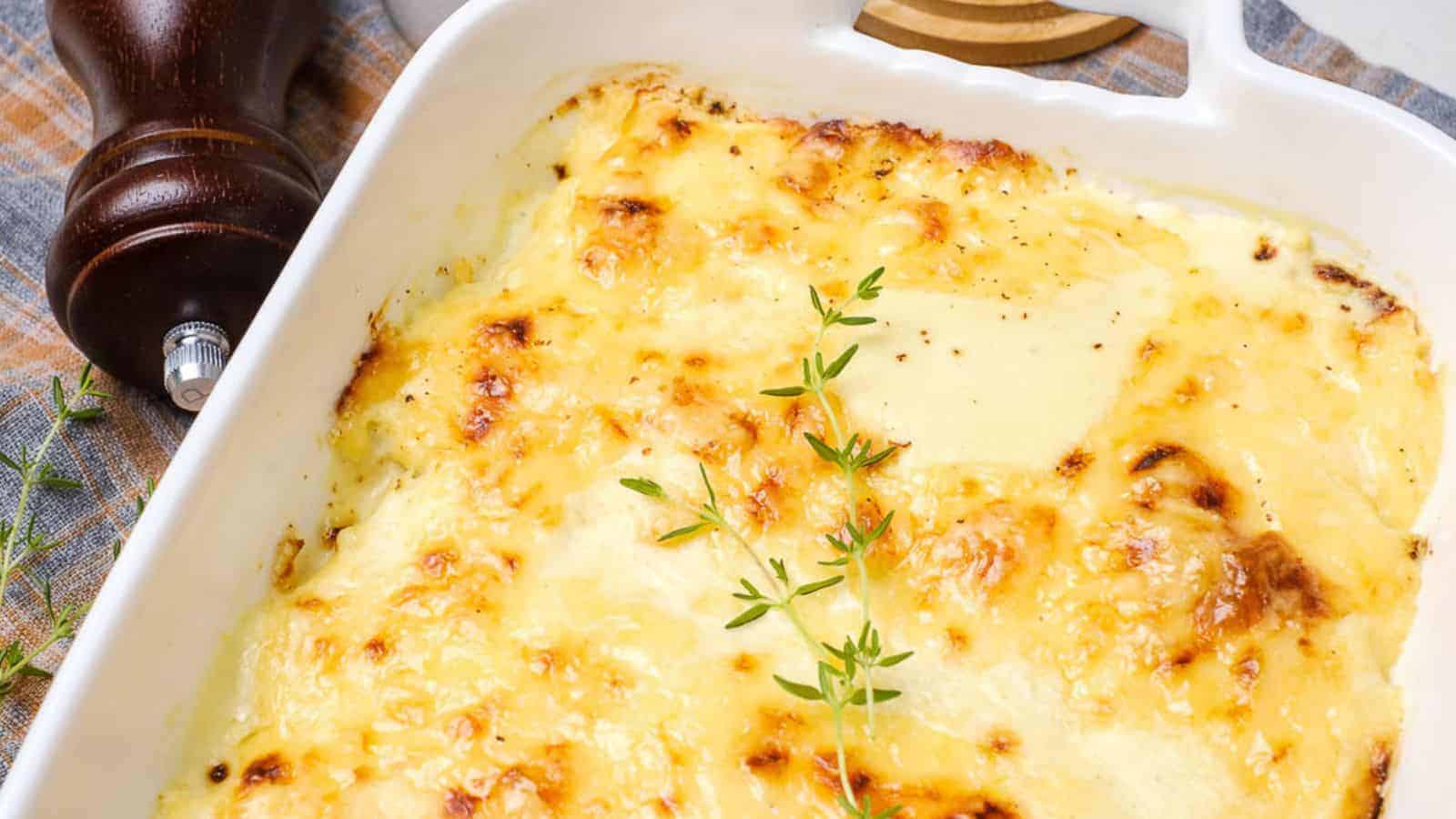 An oven dish with baked dauphinoise potatoes in it.