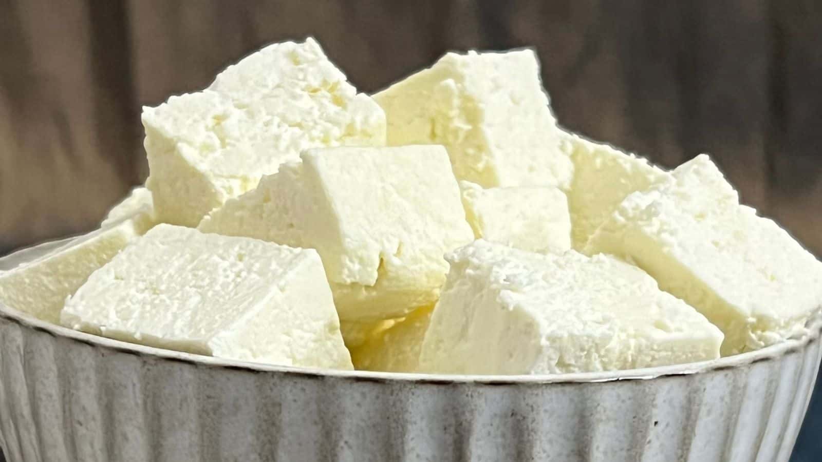 Homemade Paneer in Instant Pot filled with freshly cut cubes of white paneer cheese.
