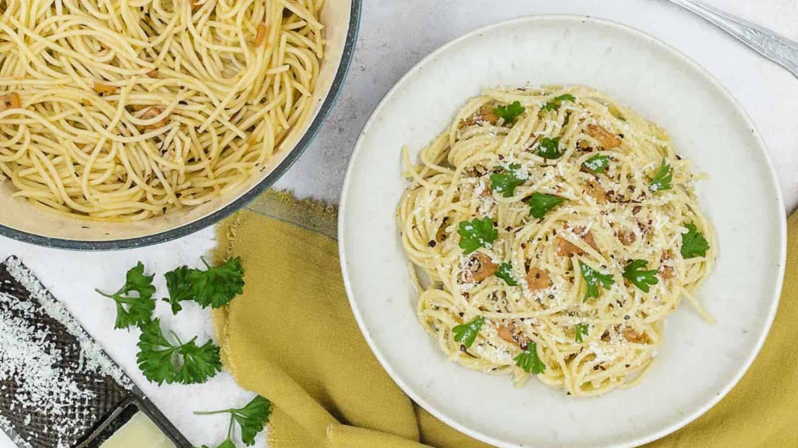 A delicious and simple pasta recipe topped with parmesan cheese and parsley.