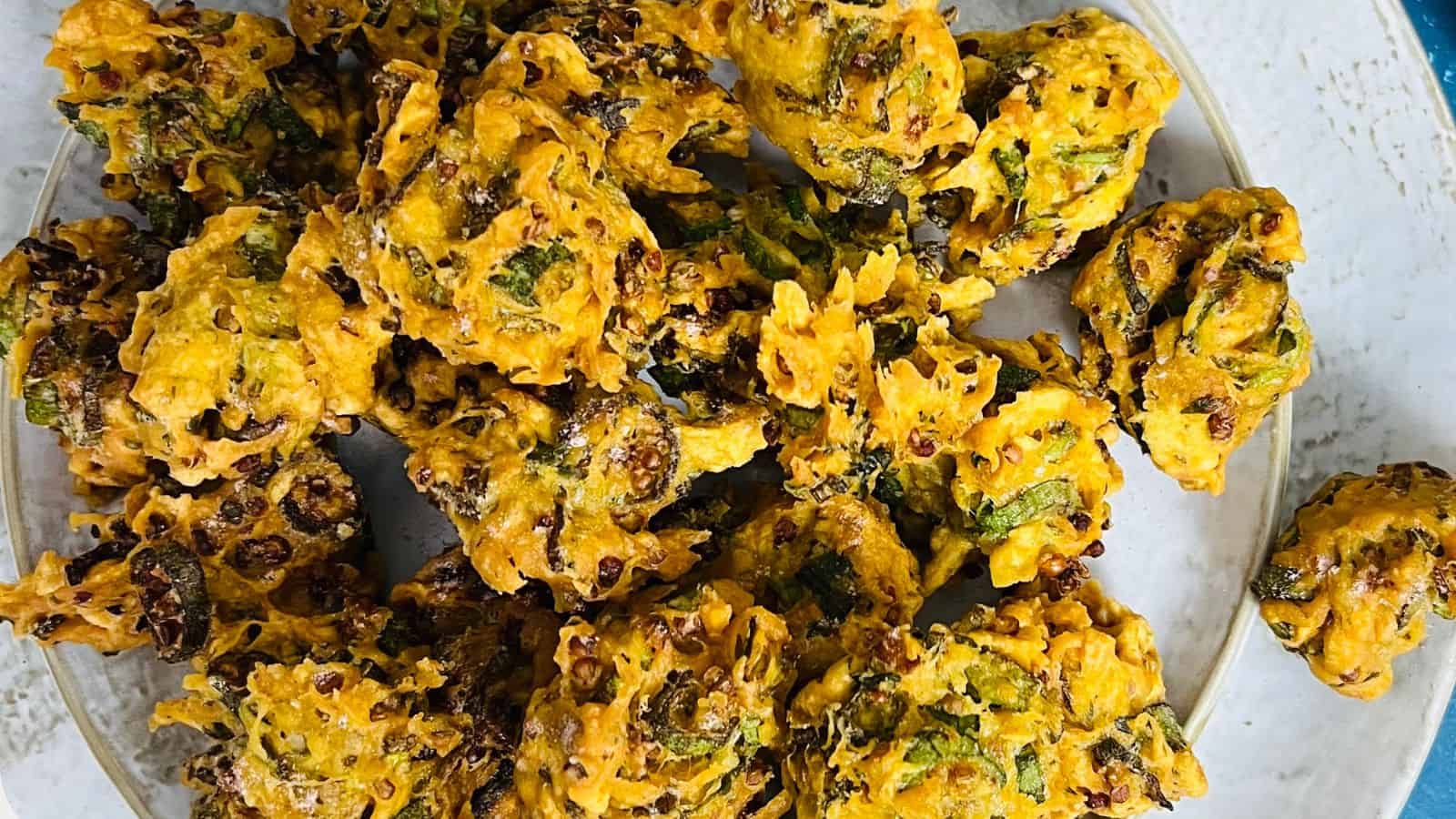 Bhindi pakora on a white plate.
