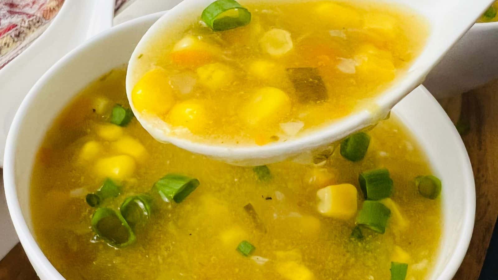 Sweet corn soup in white bowl.