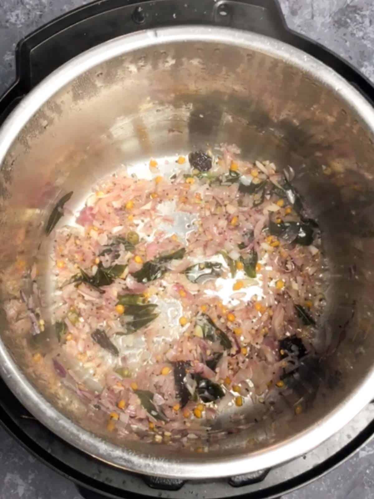 Onion and garlic being sautéed.