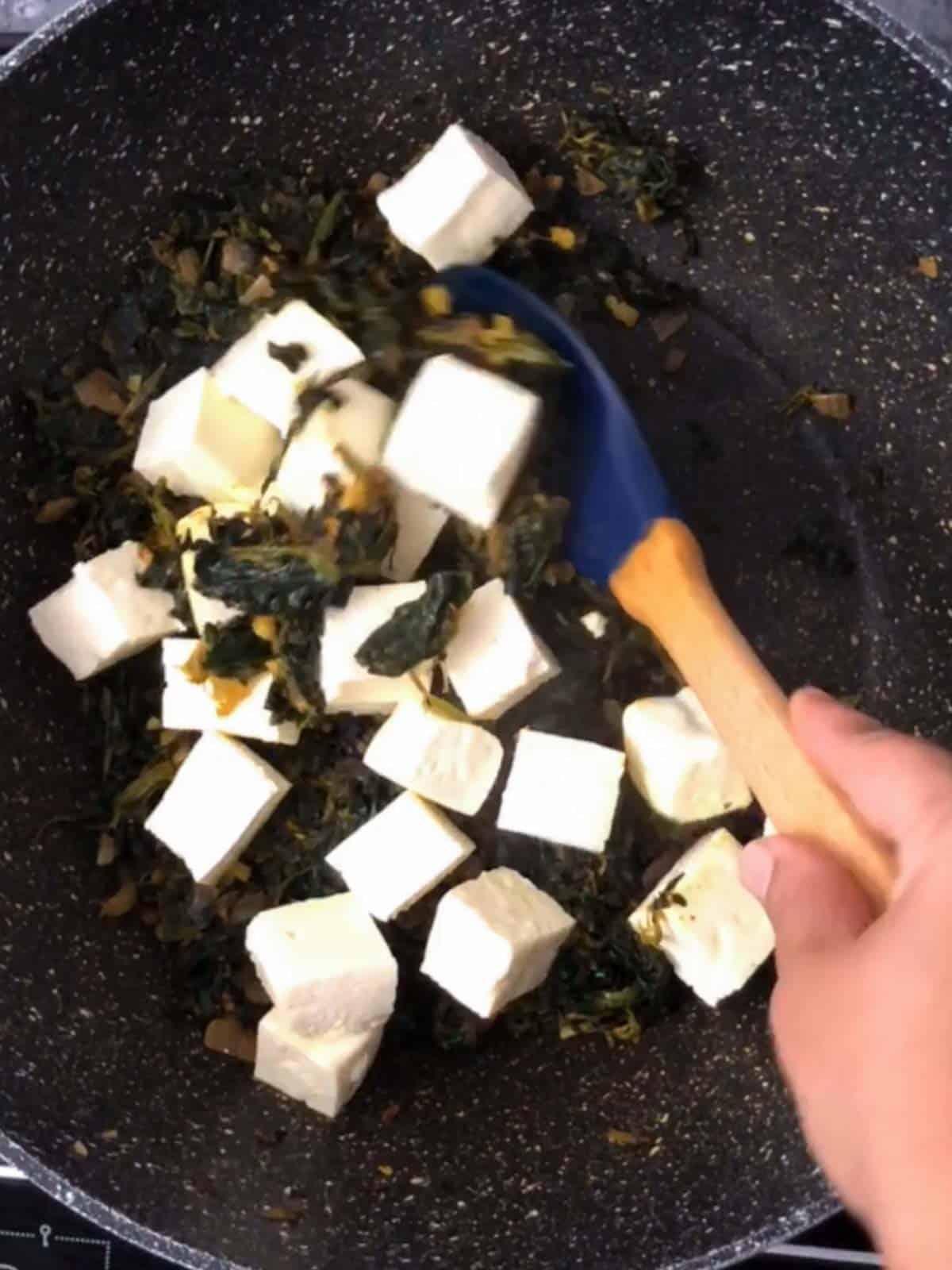 Paneer being cooked